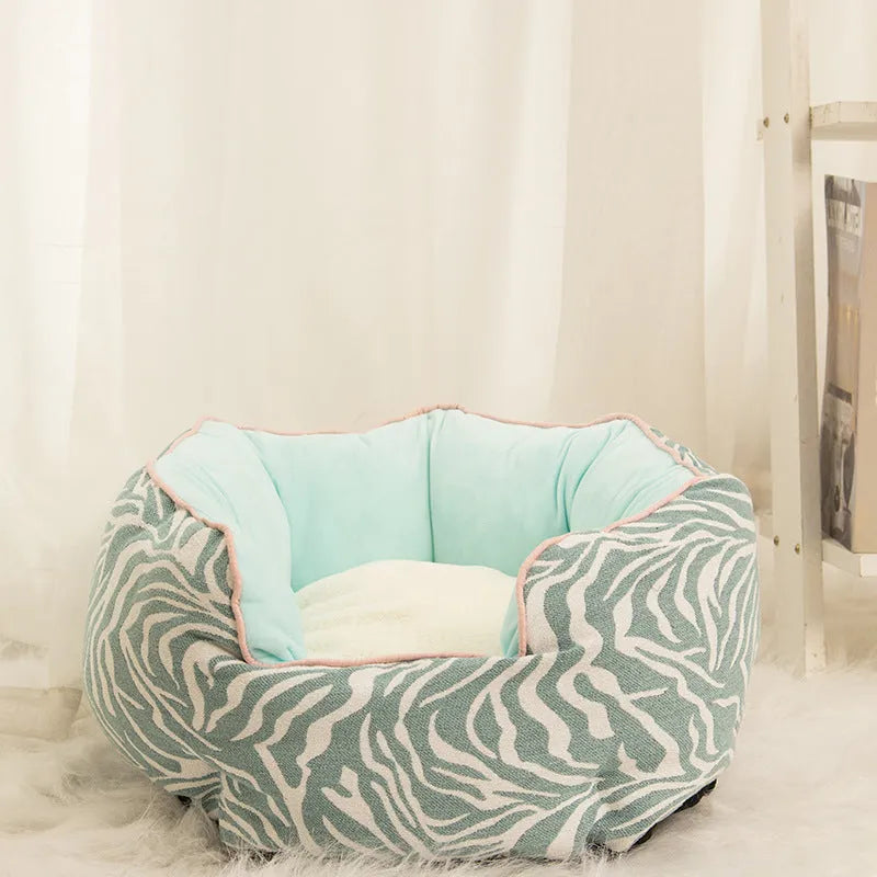 Blue octagonal pet bed with removable mat for a small dog or cat.