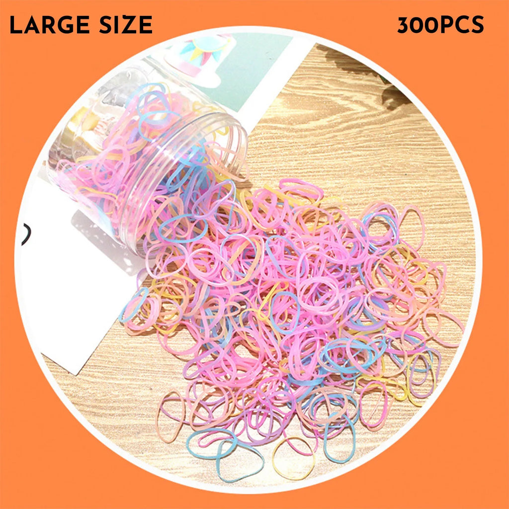 Multi-colour TPU baby hair ties in a reusable plastic storage container.
