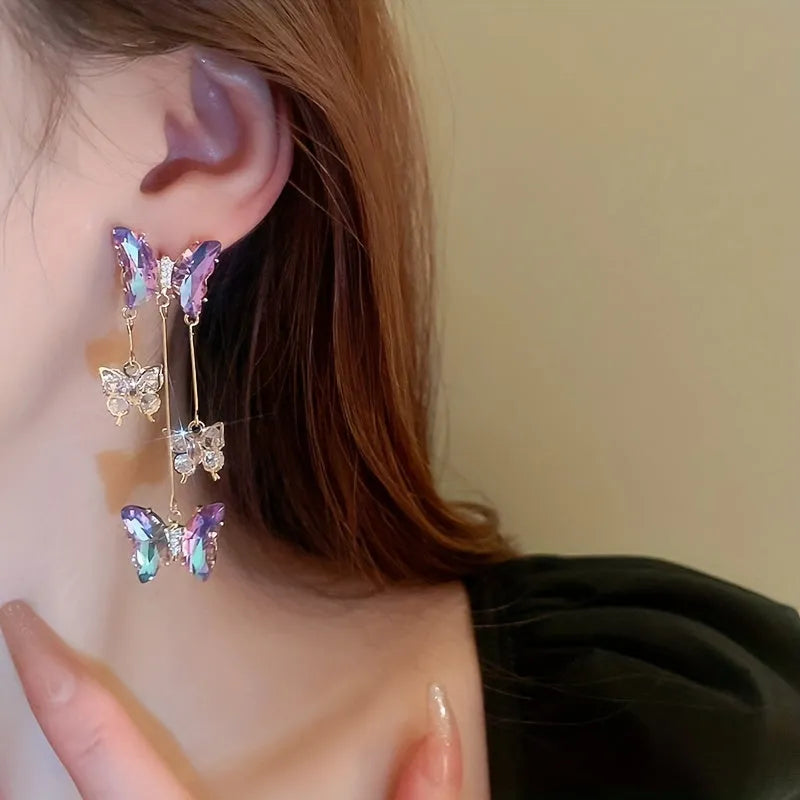 Silver needle finish blue purple butterfly and crystal flower drop tassel earrings for women.