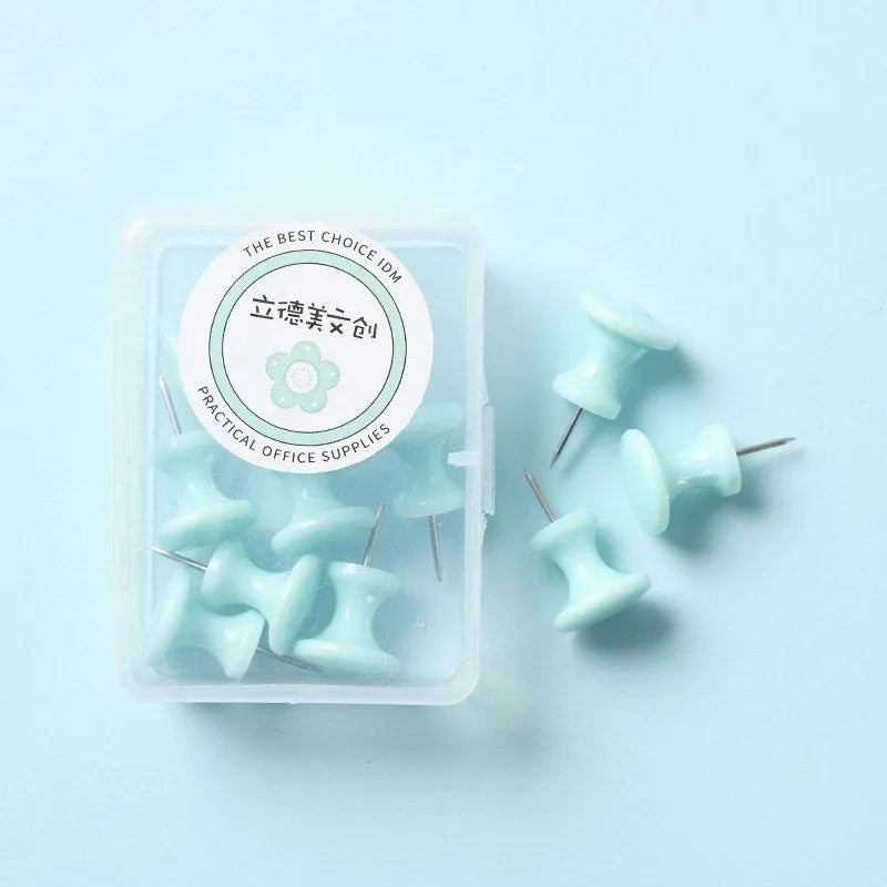 Assortment of plastic push pins in cherry blossom pink, mint green, and lavender, showing large and small sizes.