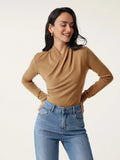 Camel coloured women's slim fit long sleeve pullover sweater on a hanger