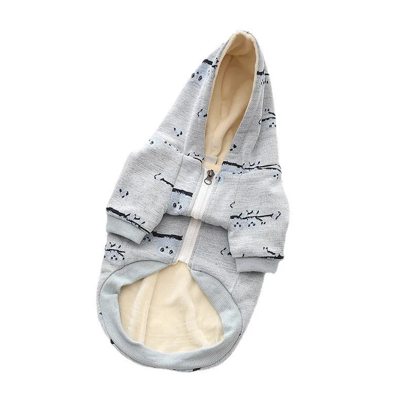 Blue cotton dog sweater with zipper front closure and dog pattern print shown on a pet