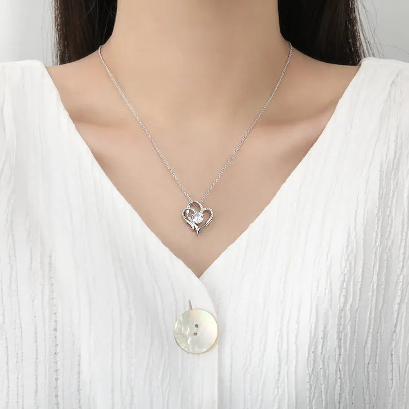 Women's heart-shaped 925 silver necklace with diamond treatment in rose, white, or yellow gold.