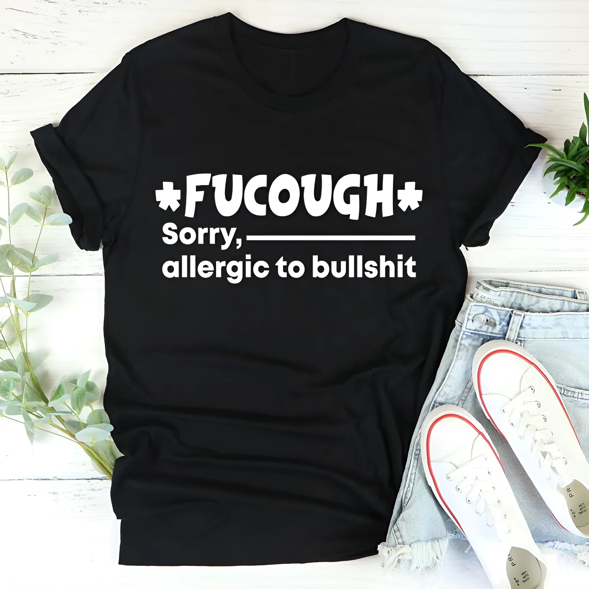 Black straight fit cotton T-shirt with short sleeves and round neck laid flat
