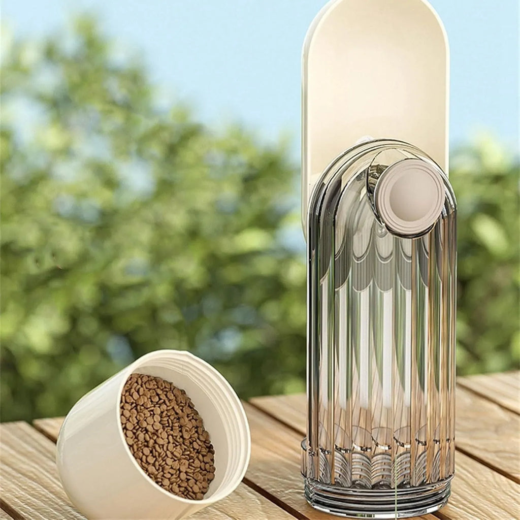 Foldable beige dog water bottle with food dispenser tray extended for drinking outdoors