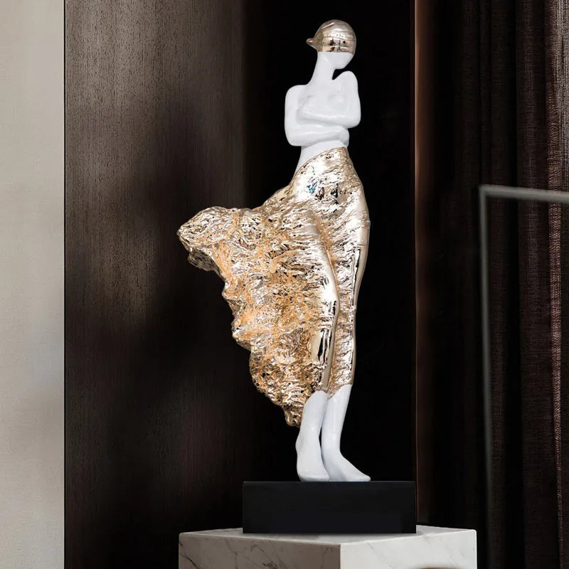 A tall, modern sculptured character ornament in a rose gold metallic finish, standing 48cm high.