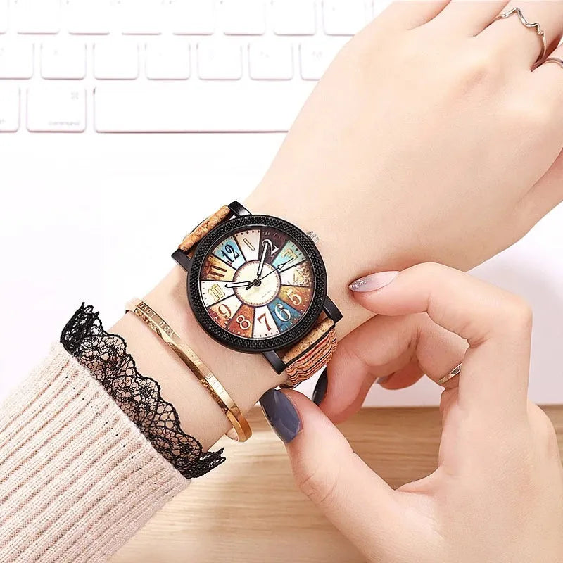 Women's vintage-style quartz watch with brown leather strap and silver round 37mm dial.