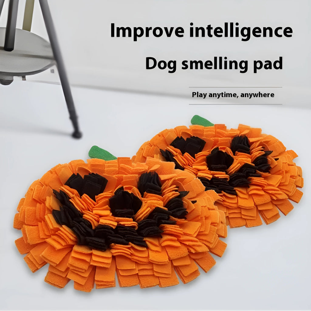 Orange polar fleece pet slow feeder mat with pumpkin-shaped pads for dog or cat food.