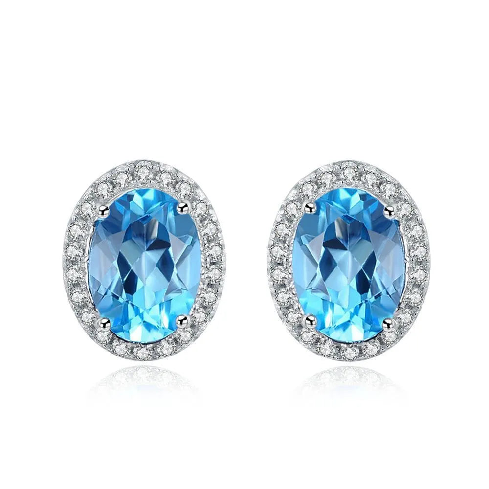 925 sterling silver blue topaz jewellery set with geometric design including earrings, ring, pendant and necklace