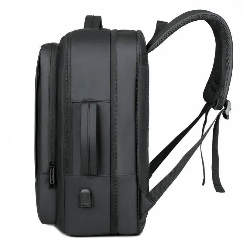 Men's large capacity waterproof backpack in black or grey with curved shoulder strap for business travel