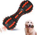 Red dumbbell-shaped durable rubber dog chew toy for aggressive chewers on a plain background.