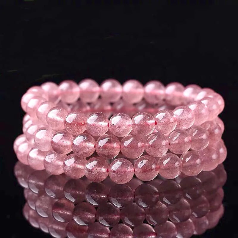 Polished strawberry quartz crystal bracelet for women showing different bead size options