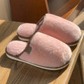 Solid colour winter plush slippers with decorative car stitching and non-slip PVC sole