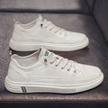 Men's white casual PU shoes with low flat heel and round toe on a plain background