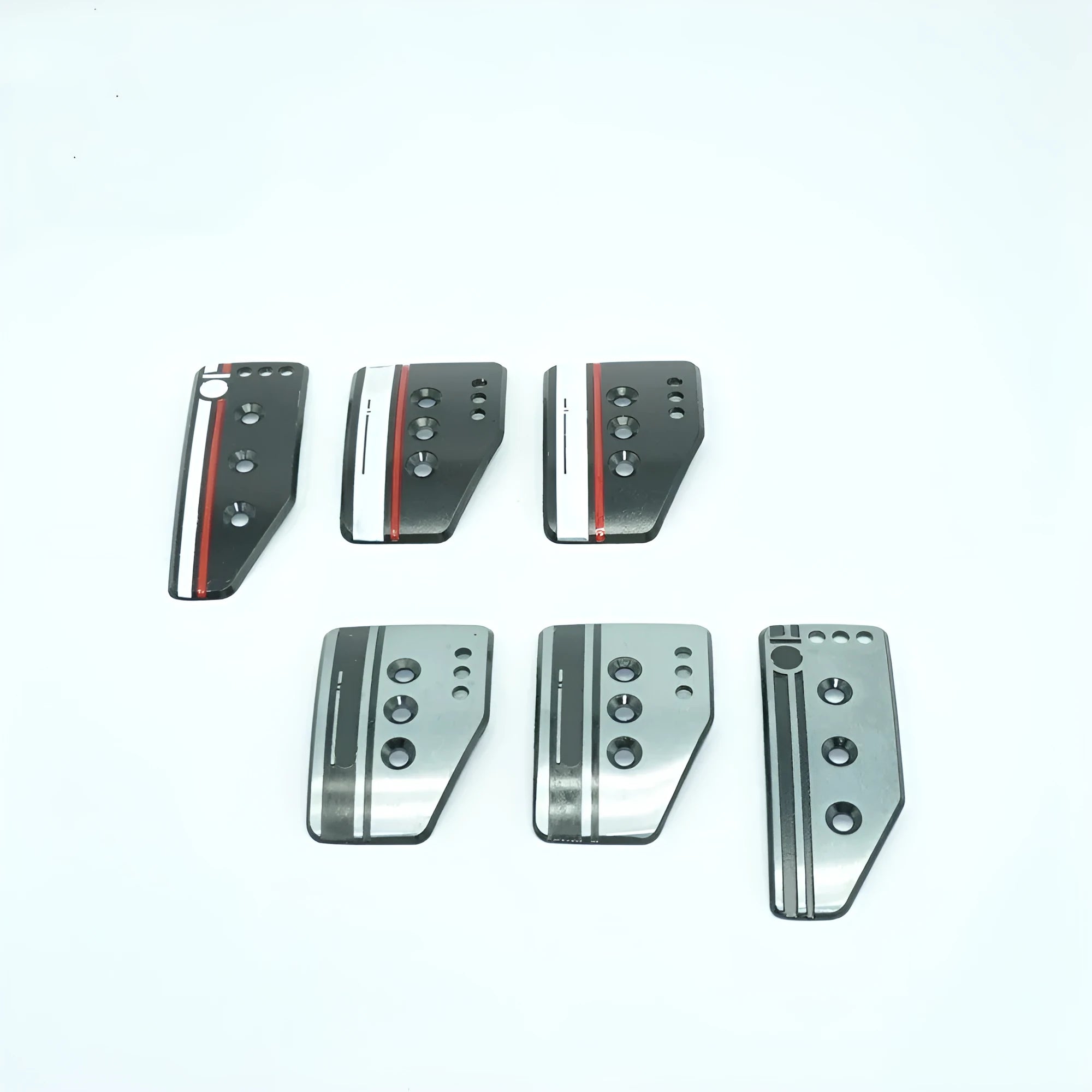Aluminium alloy manual transmission car pedal set in grey or black with brake, accelerator, and clutch pedals.