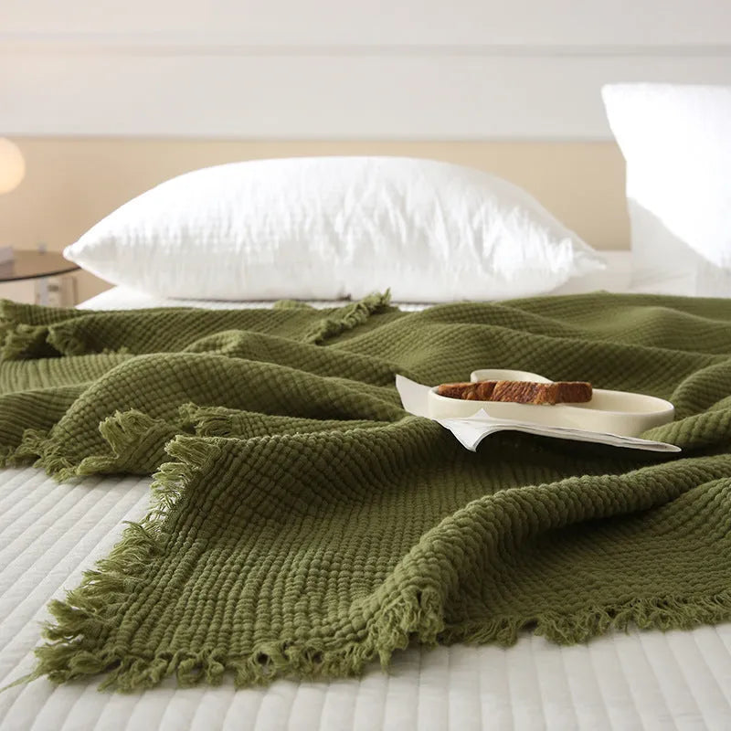 Four-layer gauze cotton blanket with tassel trim in avocado green colour