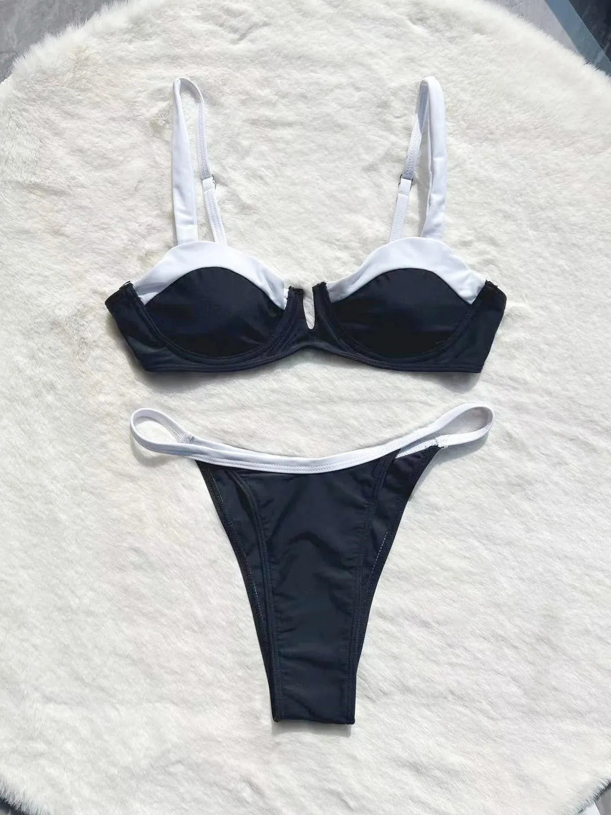 Black low-waist bikini swimsuit for women with split leg stitching, shown as a full set.