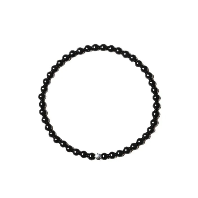 Unisex geometric bracelet with obsidian, blue San, and black agate beads.
