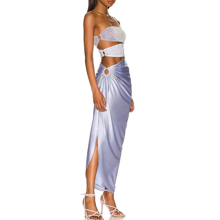 Purple hollow one-piece swimsuit with matching wrap skirt on a model.