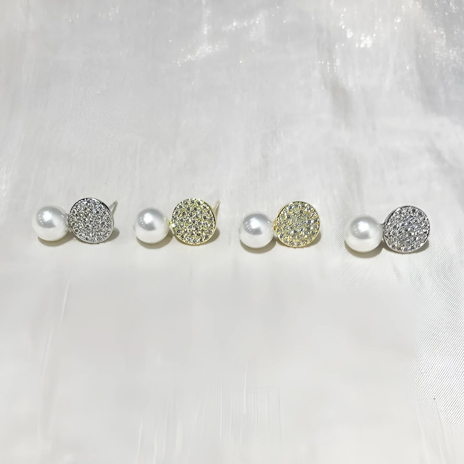 Round diamond studded pearl earrings in gold finish with secure stud fastening