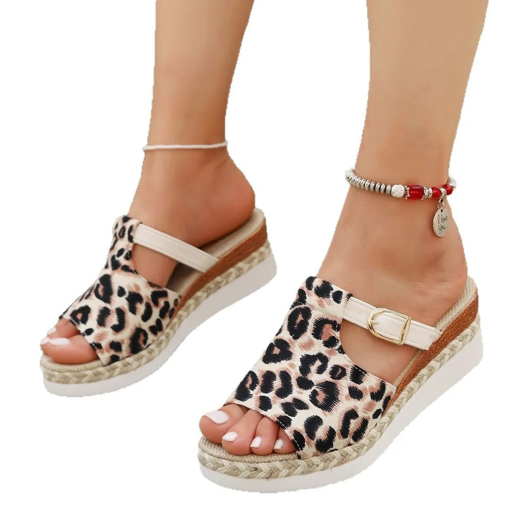 Beige leopard print platform wedge sandals with a fish mouth toe shape on a rubber sole.