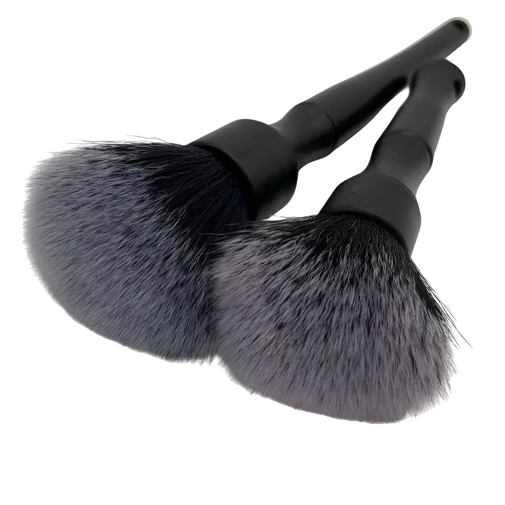 Black car detailing brush with super soft pig hair bristles for interior cleaning, shown in two size options