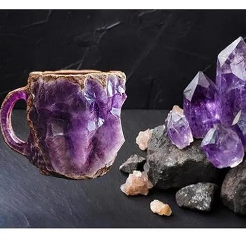 Purple and blue resin coffee mug with crystal texture and handle on wooden table