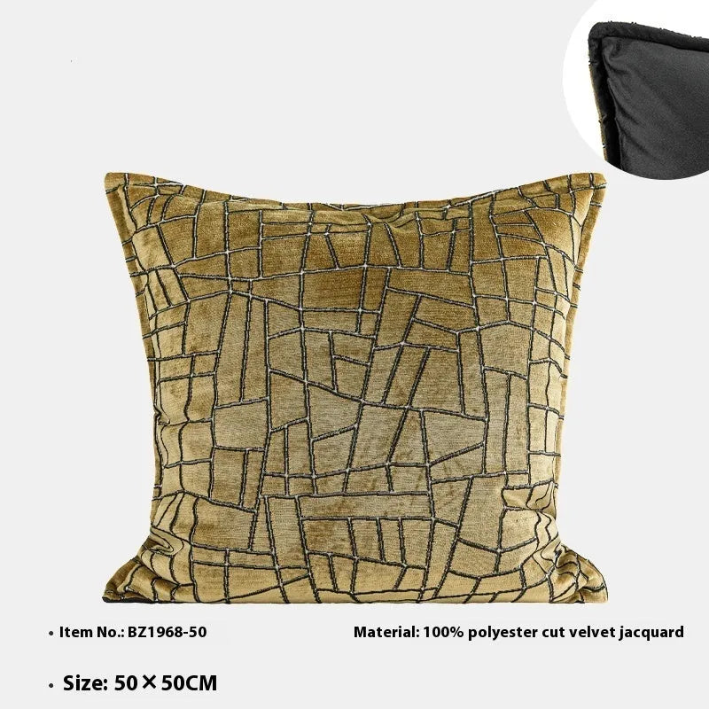 Gold and white abstract geometric patterned cushion cover on a grey sofa, showing 45x45cm square size option.
