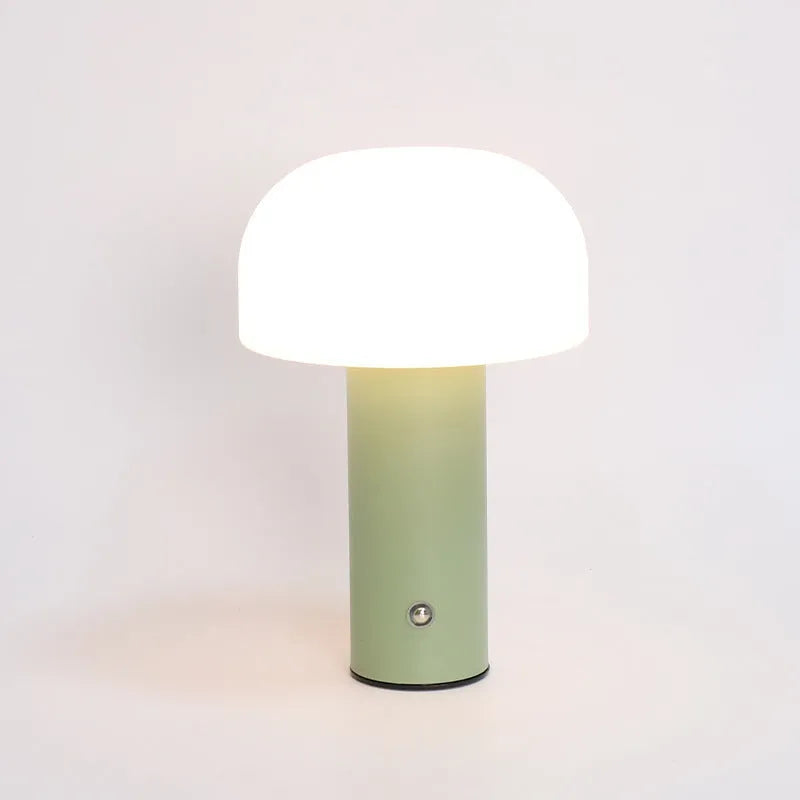 USB-powered table lamp in black, white, orange, or green, functioning as an ambient light and device charger.