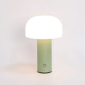 USB-powered table lamp in black, white, orange, or green, functioning as an ambient light and device charger.