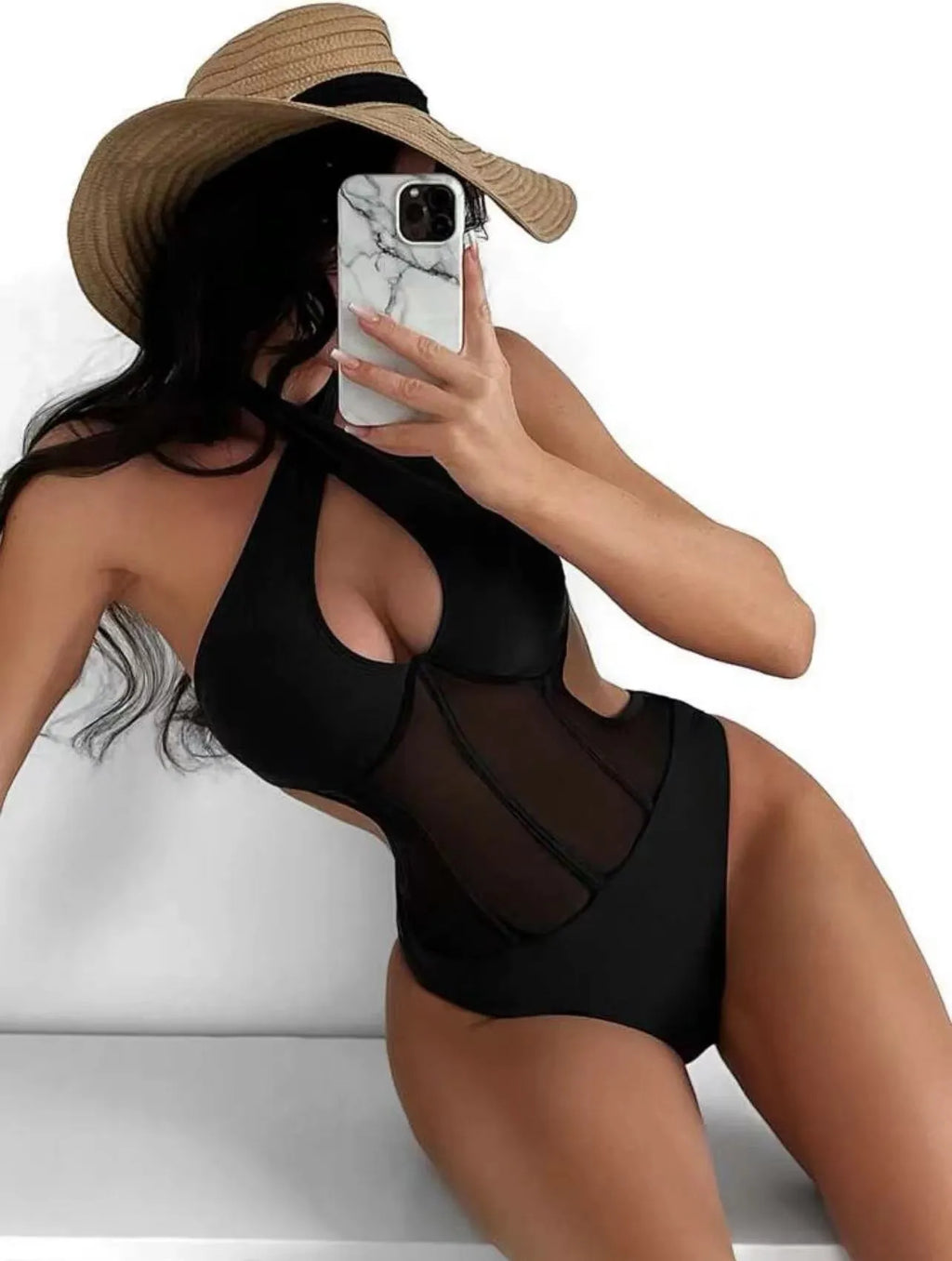 A women's one-piece bikini swimsuit in a nylon-spandex blend, shown in black, rose red, and green colour options.