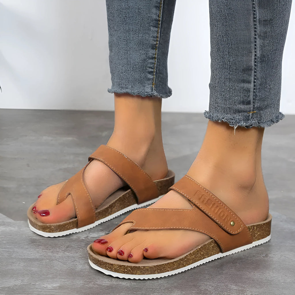 Women's blue flip-flops with a thick foam sole and a flat toe ring design on a solid colour artificial PU upper.