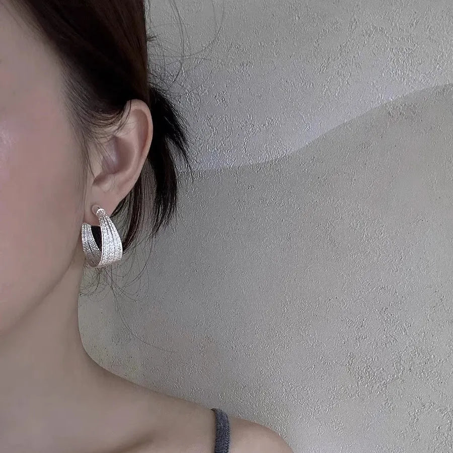 Geometric multi-layer earrings with electroplated gold or silver finish and clip or stud backings