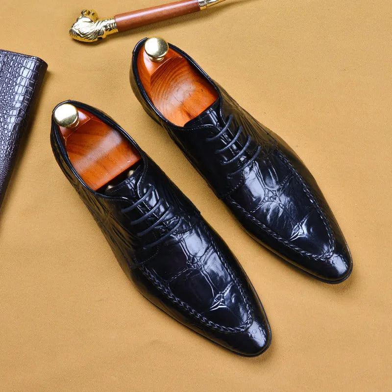 Men's black and brown leather shoes with alligator pattern texture and horse bit buckle detail