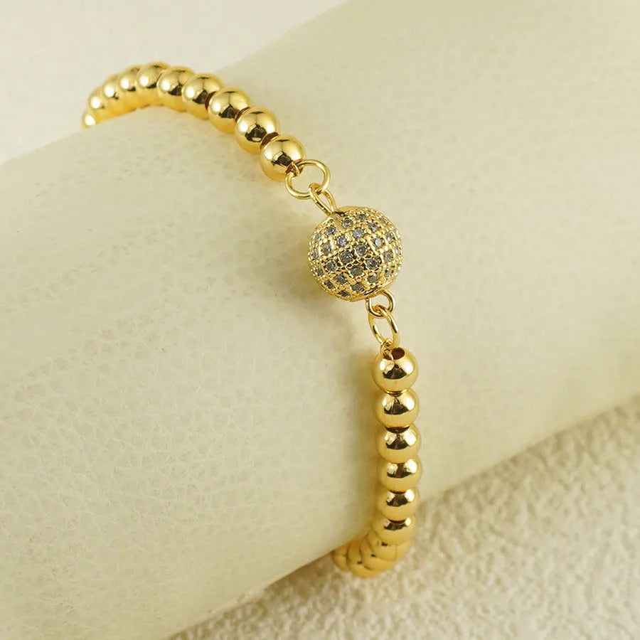 Women's heart-shaped copper bracelet with single ball zircon accents and electroplated finish