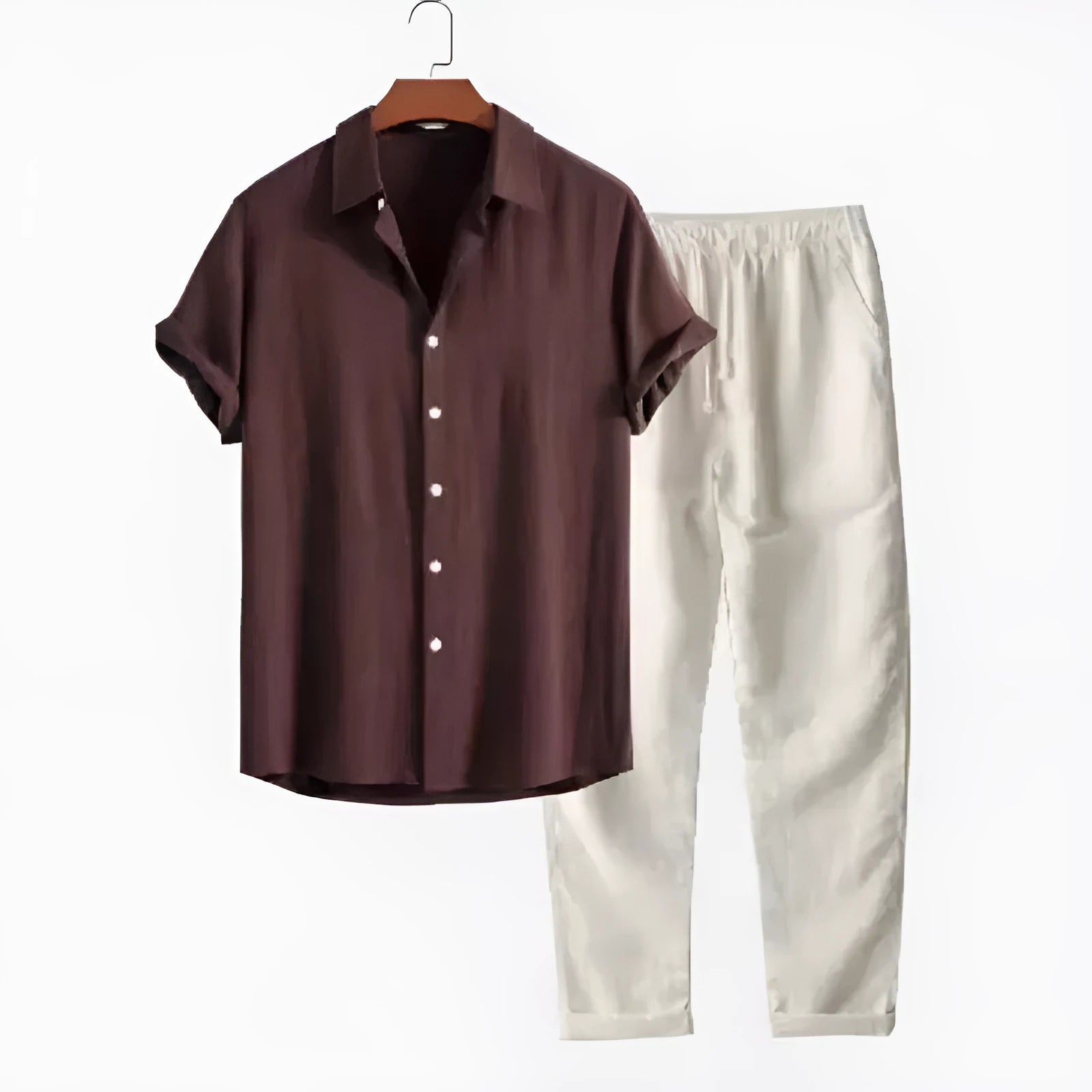 Man wearing a loose casual short-sleeve linen-look shirt and matching trousers in a solid colour.
