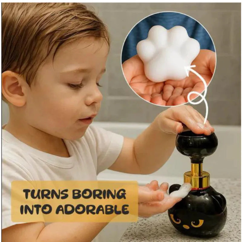 Black cartoon cat-shaped plastic foam soap dispenser, 10cm wide by 18cm tall.