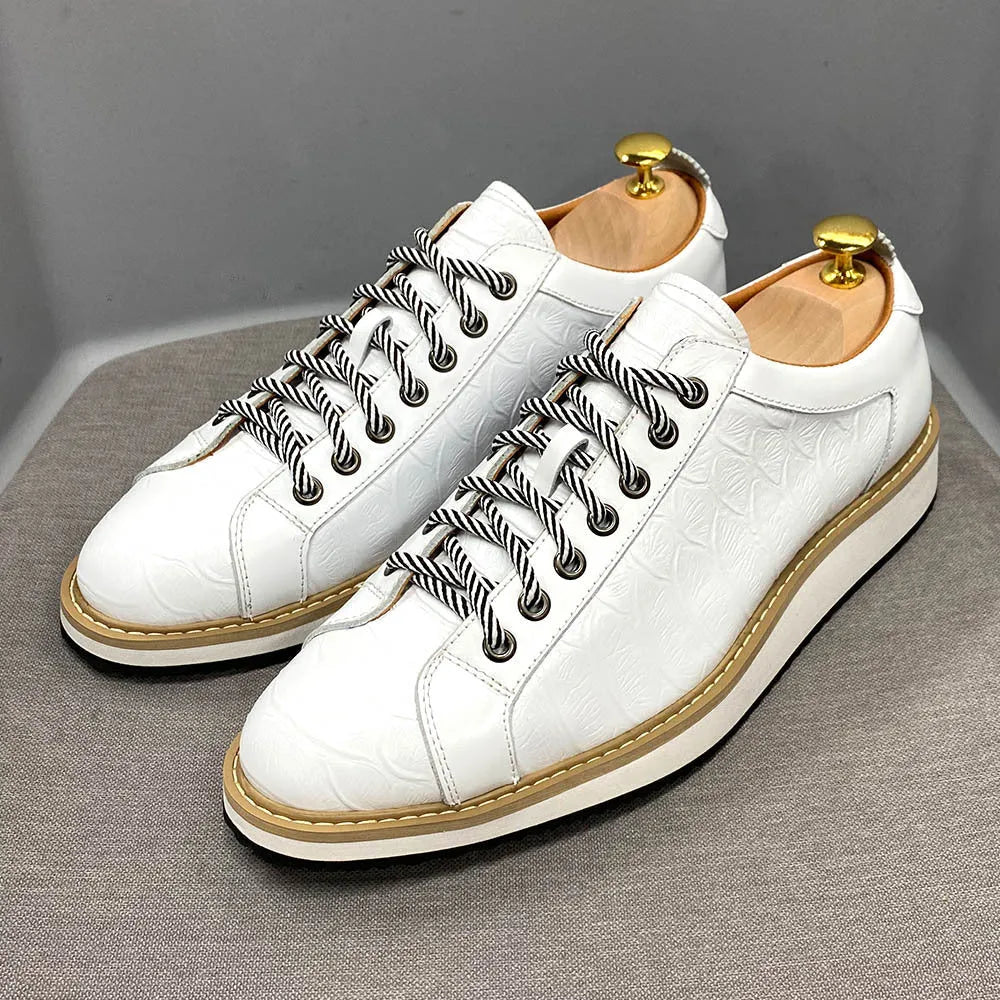 Men's low-top handmade shoes with an embossed pattern and front lace closure, shown in a choice of colours.