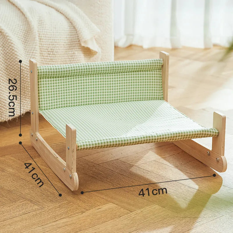 Wooden frame cat hammock bed with soft blue cloth on a wooden beach chair structure