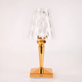 Rose gold plated portable touch control night light on a surface, showing its cubic base and height.