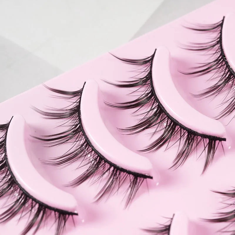 Set of manga anime style false eyelashes showing three styles 007, 008, 009 on a plastic black terrier band.