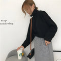 Women's solid colour long sleeve top with a half-high collar in a loose fit.