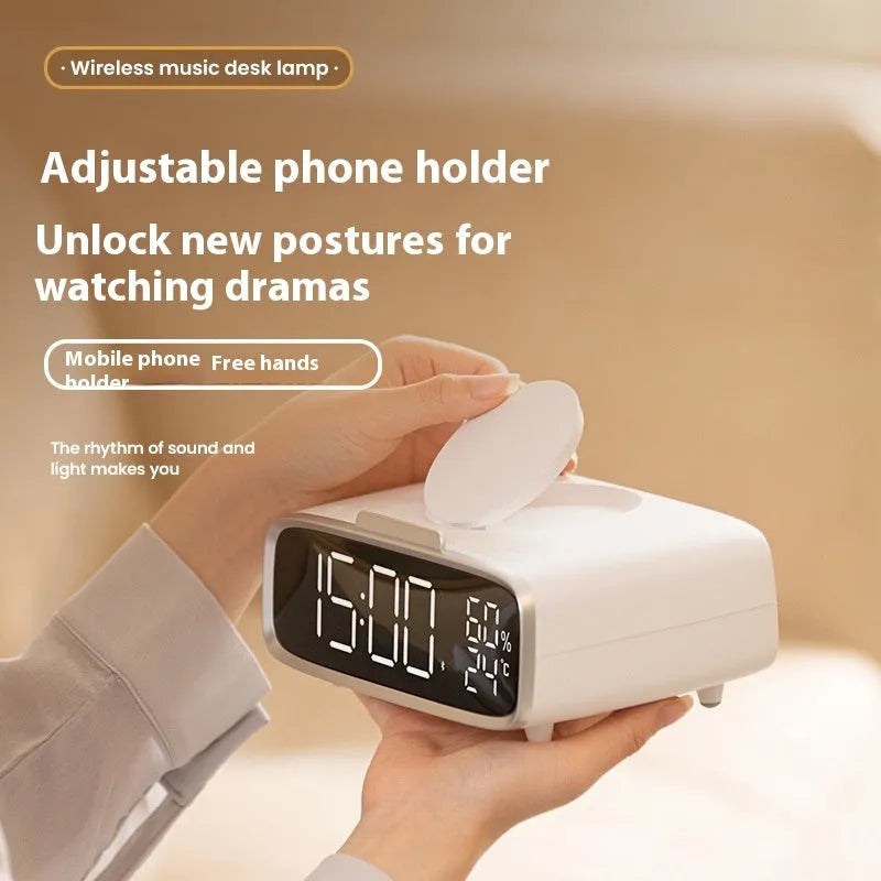 White wireless charger Bluetooth speaker with night light functionality on wooden surface