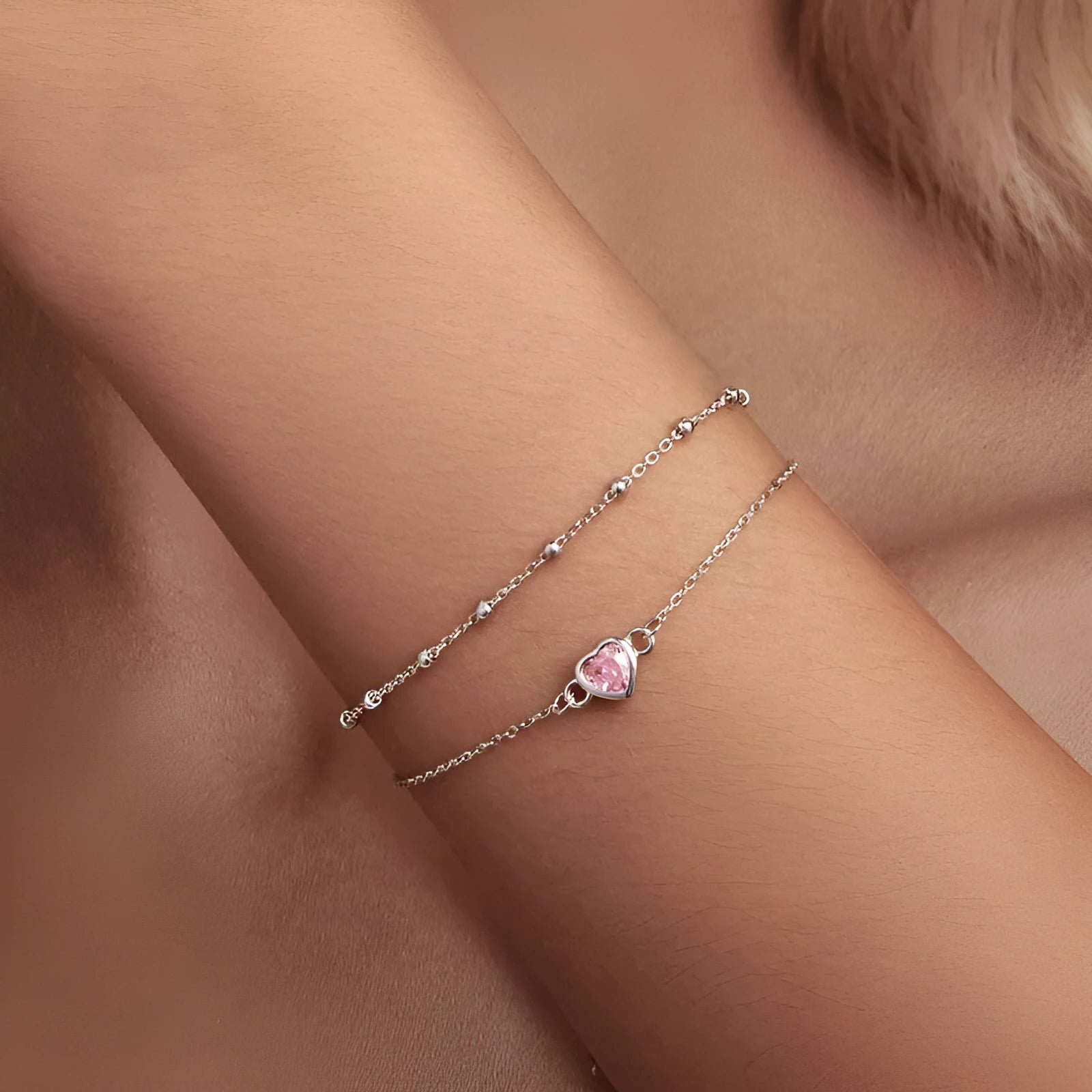 Women's sweet girlish style sterling silver bracelet with a small heart charm on an adjustable chain.