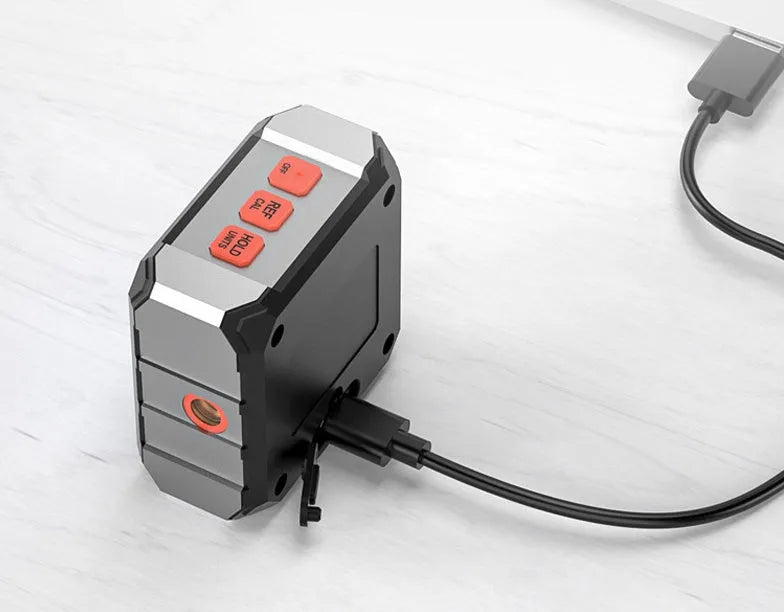 Laser infrared digital inclinometer with extended steel tape measure, showing alloy casing and display.
