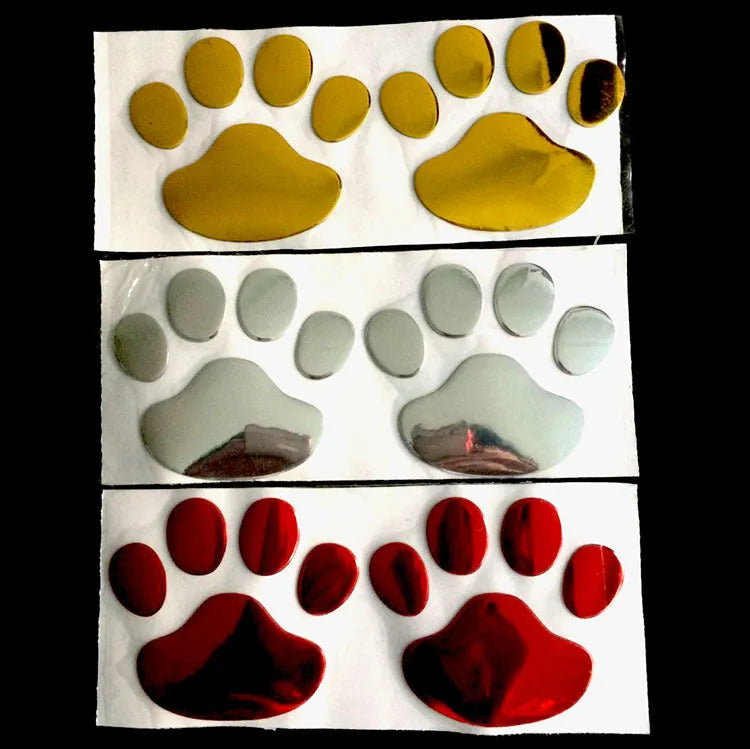 Pair of hand-shaped dog footprint car stickers in four colour options, each 7 cm long.