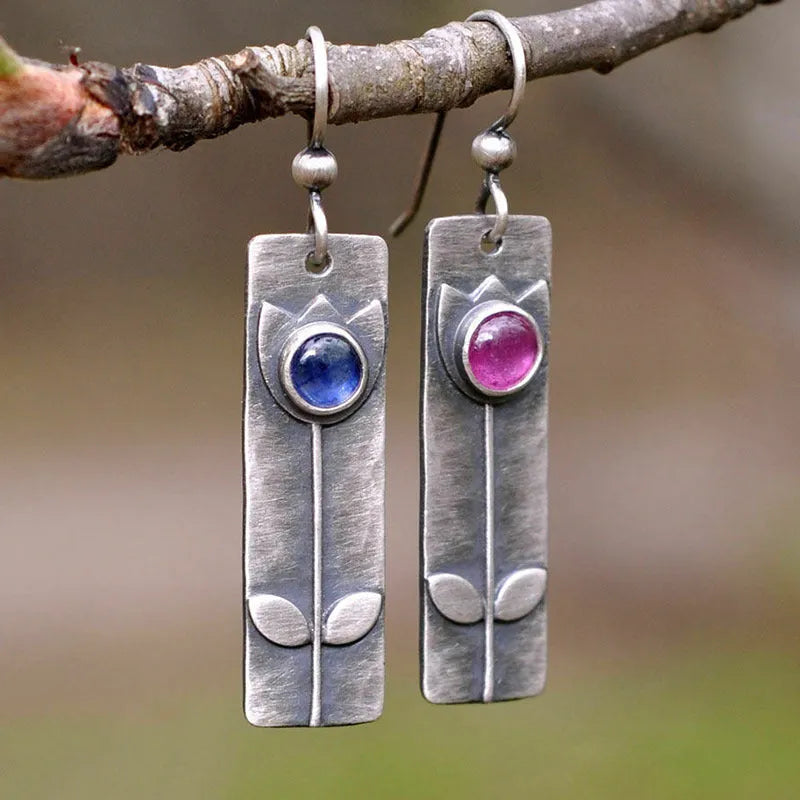 Antique finish red sapphire electroplated metal earrings with geometric ellipse design