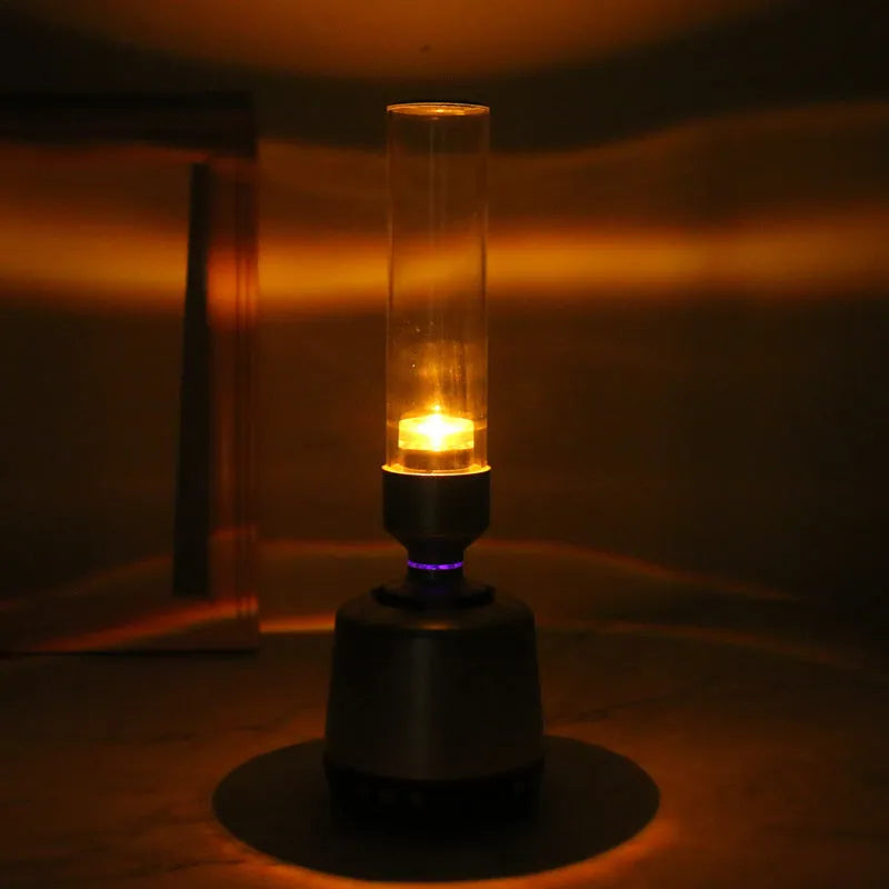 White silver Bluetooth speaker with LED candlelight night light showing modern simple design