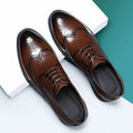 Men's black and brown brogue leather shoes for business occasions with traditional perforated detailing