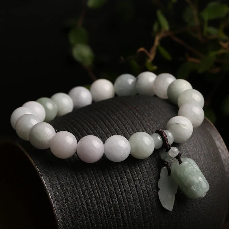 Natural emerald jade bracelet with hanging Maitreya Buddha charm and geometric design